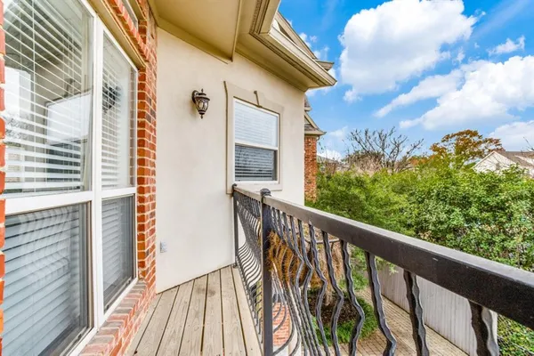 a view of balcony with wooden floor