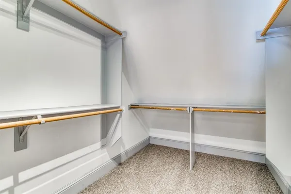 a view of an empty walk in closet