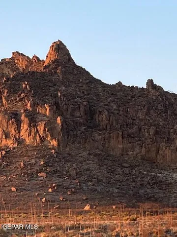 a view of a house with a mountain