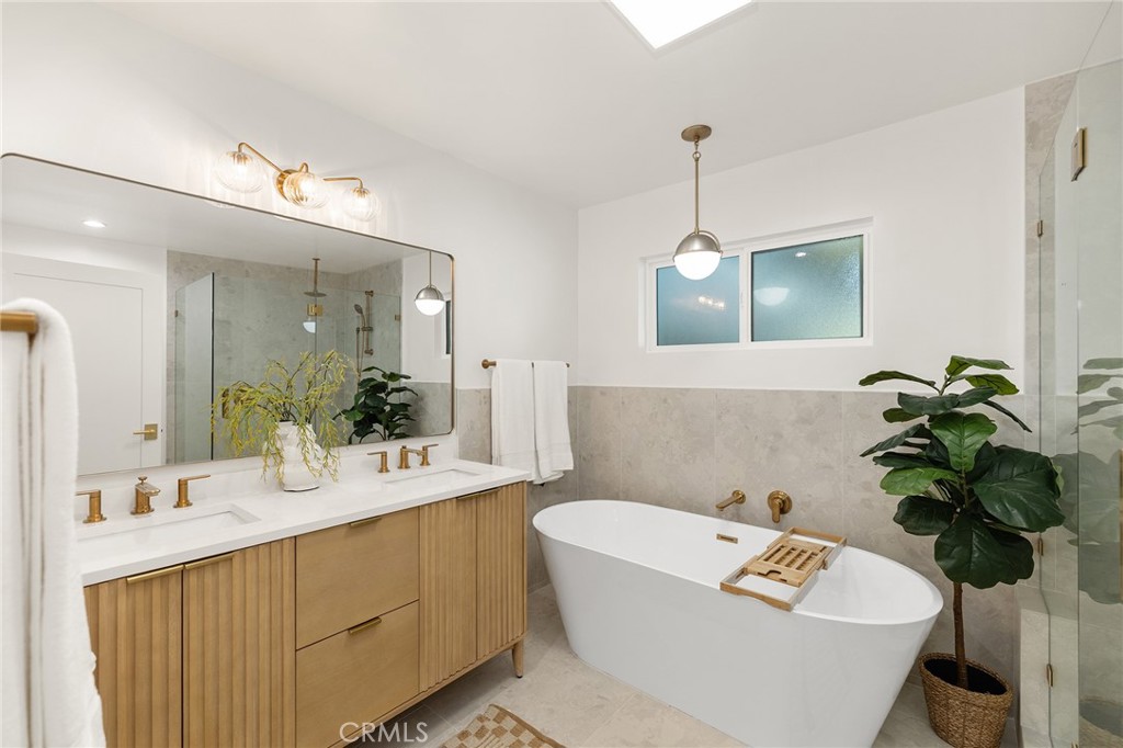 1848 North Altadena Drive Pasadena, CA 91107 - Photo 19 of 45 a bathroom with a bathtub a sink and a mirror