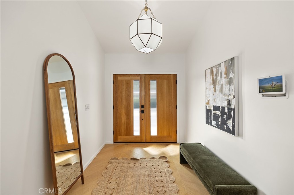 1848 North Altadena Drive Pasadena, CA 91107 - Photo 2 of 45 a view of a hallway with windows and chandelier