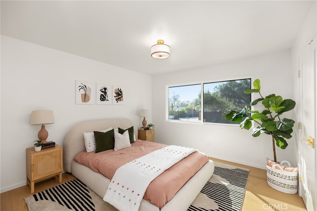 1848 North Altadena Drive Pasadena, CA 91107 - Photo 21 of 45 a bedroom with a bed and a window