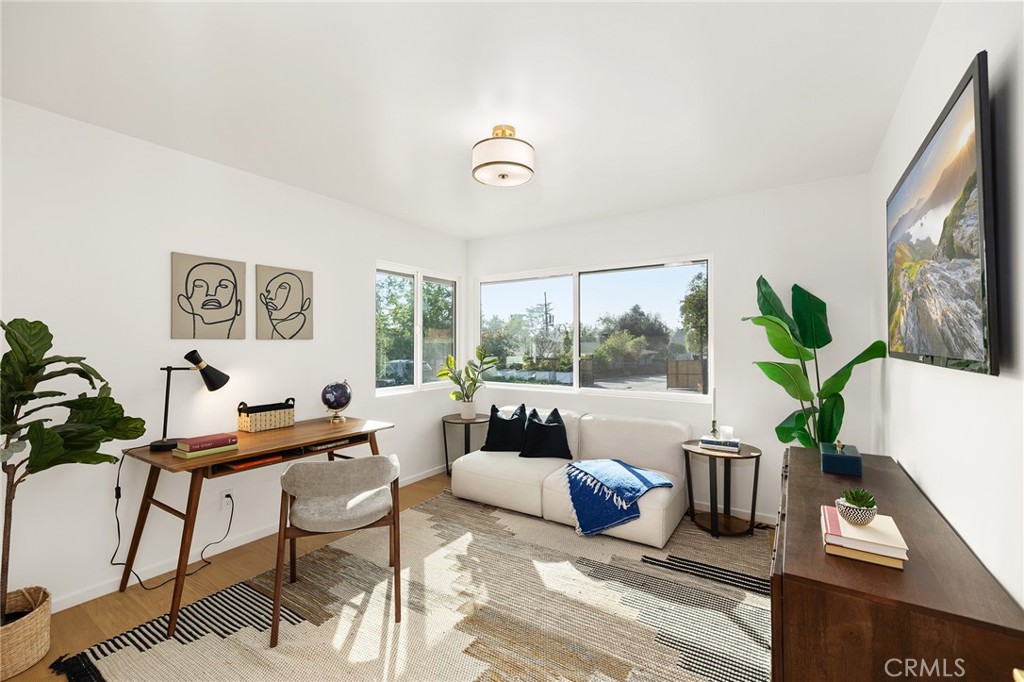 1848 North Altadena Drive Pasadena, CA 91107 - Photo 22 of 45 a living room with furniture and a large window