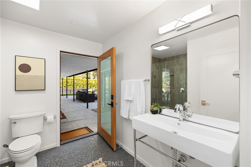 1848 North Altadena Drive Pasadena, CA 91107 - Photo 31 of 45 a bathroom with a sink a toilet and shower