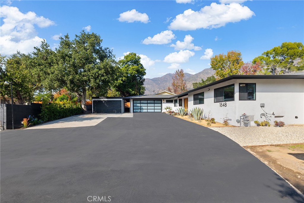 1848 North Altadena Drive Pasadena, CA 91107 - Photo 42 of 45 a front view of a house with a garden