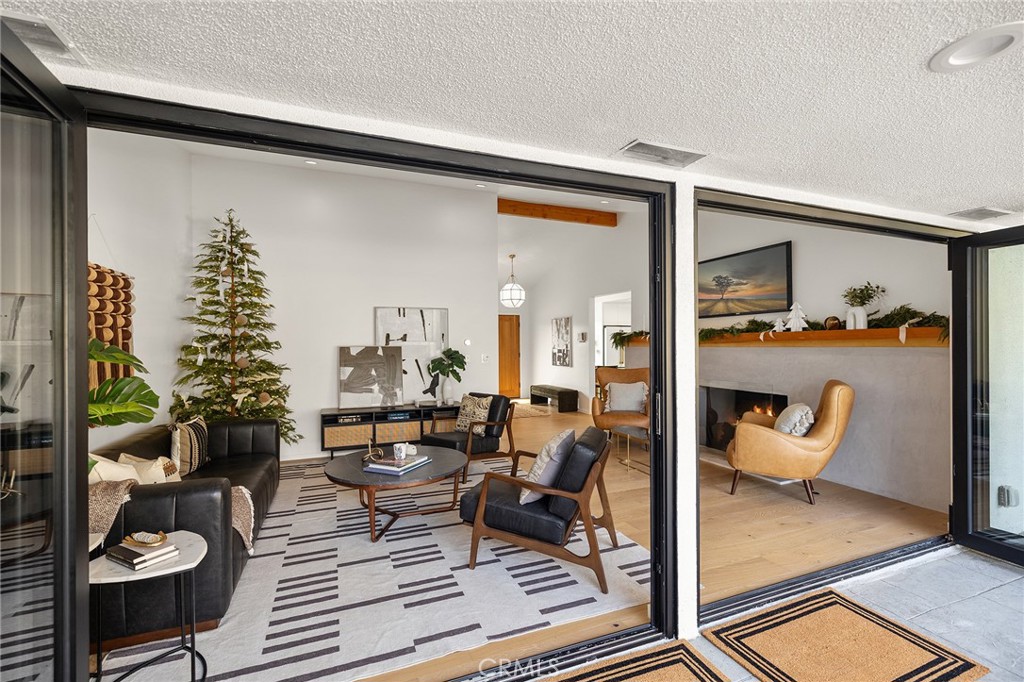 1848 North Altadena Drive Pasadena, CA 91107 - Photo 7 of 45 a living room with furniture and a potted plant
