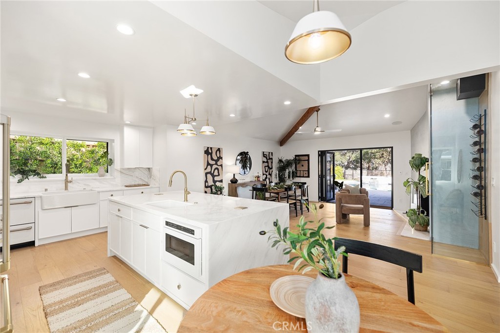 1848 North Altadena Drive Pasadena, CA 91107 - Photo 10 of 45 a large white kitchen with a large window and stainless steel appliances