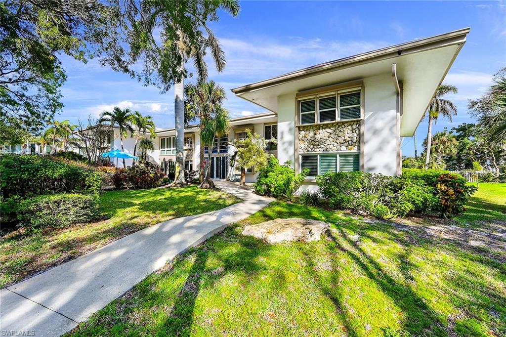 1334 Crayton Road, Unit 1 Naples, FL 34102 - Photo 22 of 22 Backyard Sidewalk