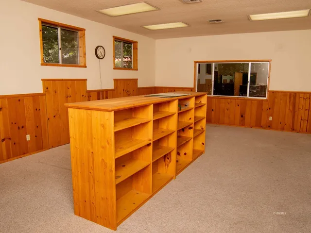 a view of empty room with floor to ceiling window