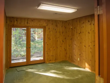 a view of an empty room with a window