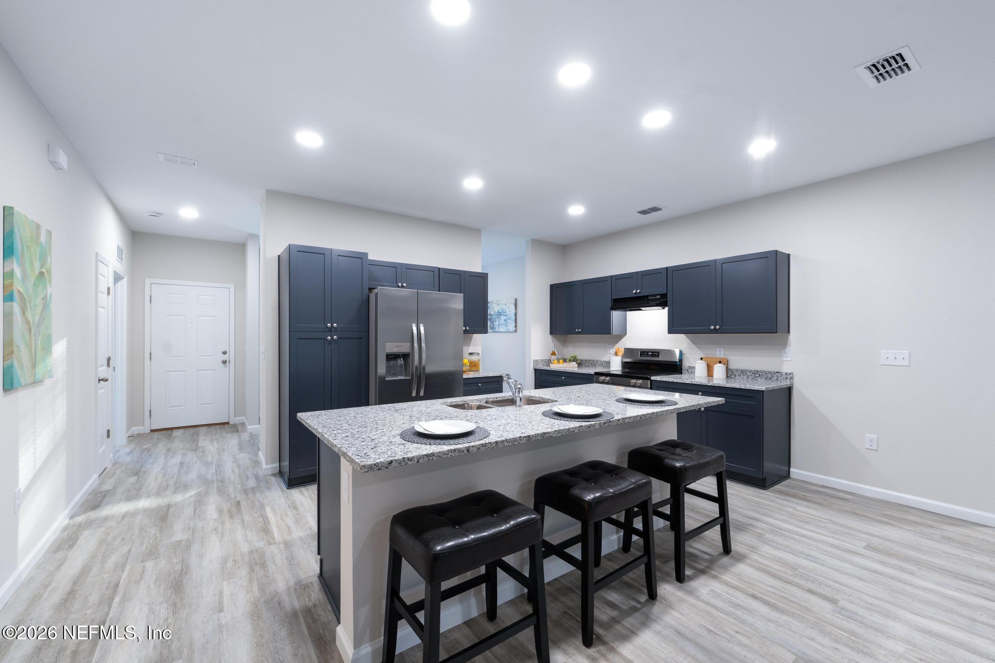7581 Dove Road Jacksonville, FL 32219 - Photo 13 of 32 a view of a dining room with furniture