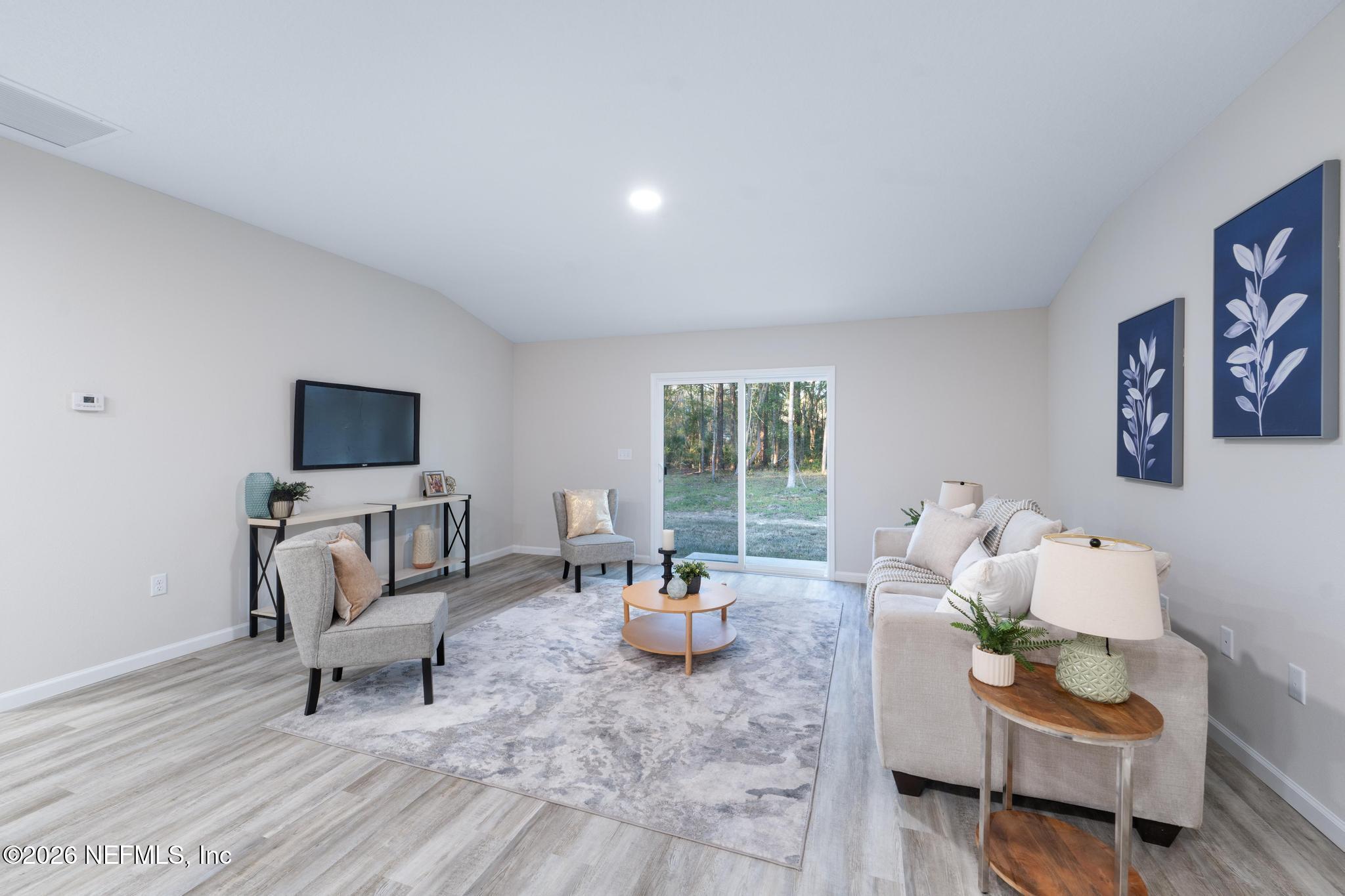 7581 Dove Road Jacksonville, FL 32219 - Photo 17 of 32 a living room with furniture and a flat screen tv