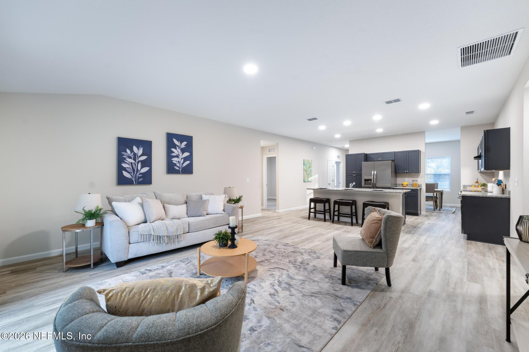 7581 Dove Road Jacksonville, FL 32219 - Photo 19 of 32 a living room with furniture kitchen view and a couch