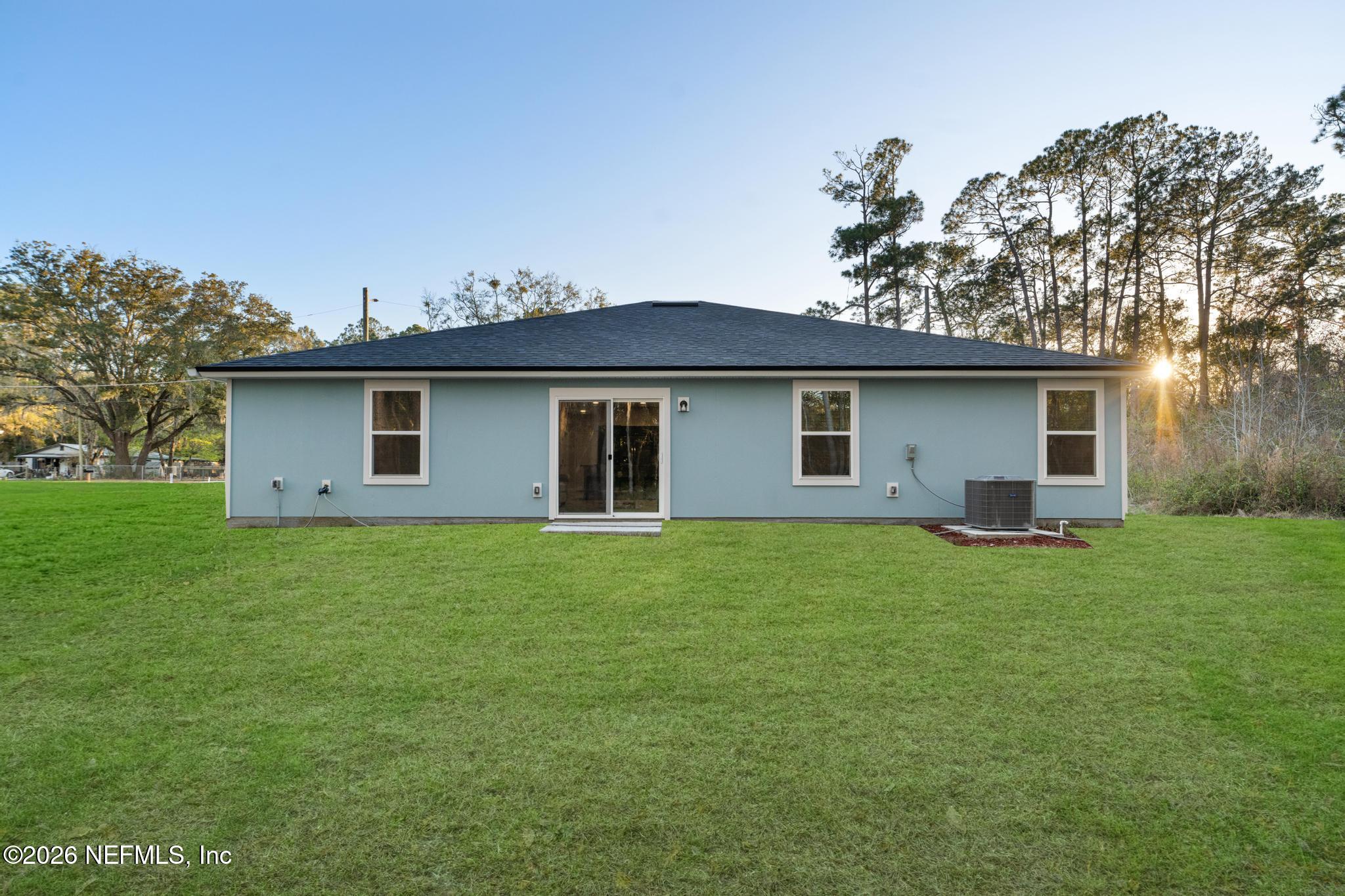 7581 Dove Road Jacksonville, FL 32219 - Photo 32 of 32 a house view with a garden space