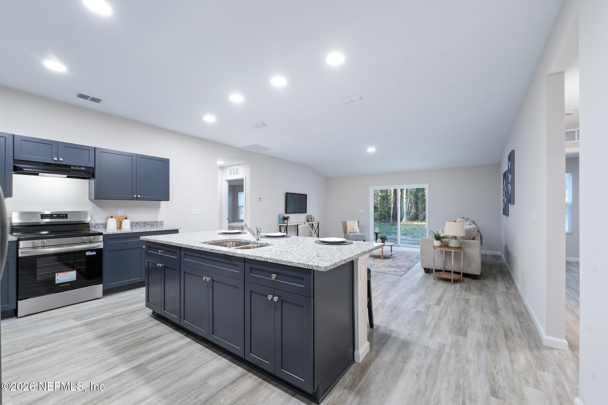 7581 Dove Road Jacksonville, FL 32219 - Photo 10 of 32 a kitchen with sink stove and refrigerator