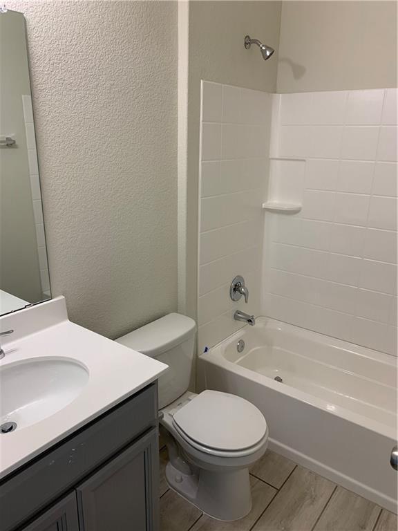 1229 Cliffbrake Way Georgetown, TX 78626 - Photo 15 of 24 a bathroom with a sink a toilet and bathtub