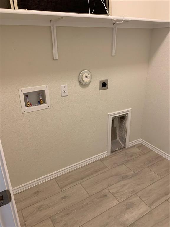 1229 Cliffbrake Way Georgetown, TX 78626 - Photo 16 of 24 a view of a livingroom with a washer and dryer