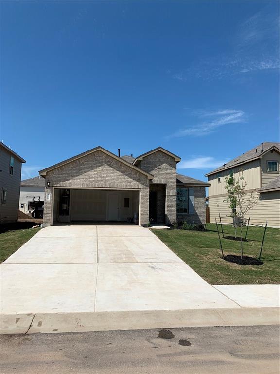 1229 Cliffbrake Way Georgetown, TX 78626 - Photo 2 of 24 a front view of a house with a yard