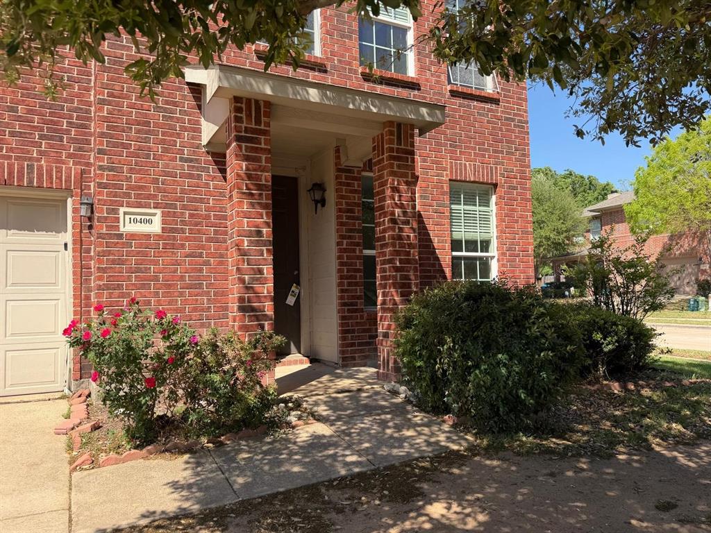 10400 Wagon Rut Court Fort Worth, TX 76108 - Photo 3 of 26 Entrance to property with brick siding and a garage