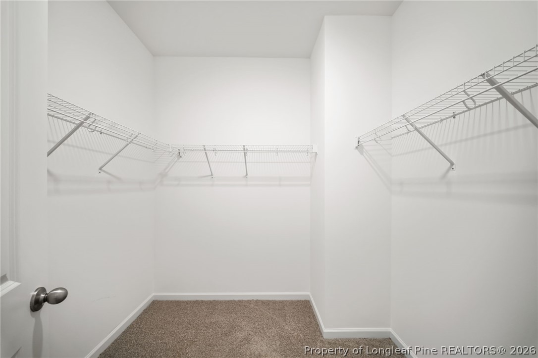 4052 Lofton Street Wade, NC 28395 - Photo 21 of 22 a view of a room with racks on the wall