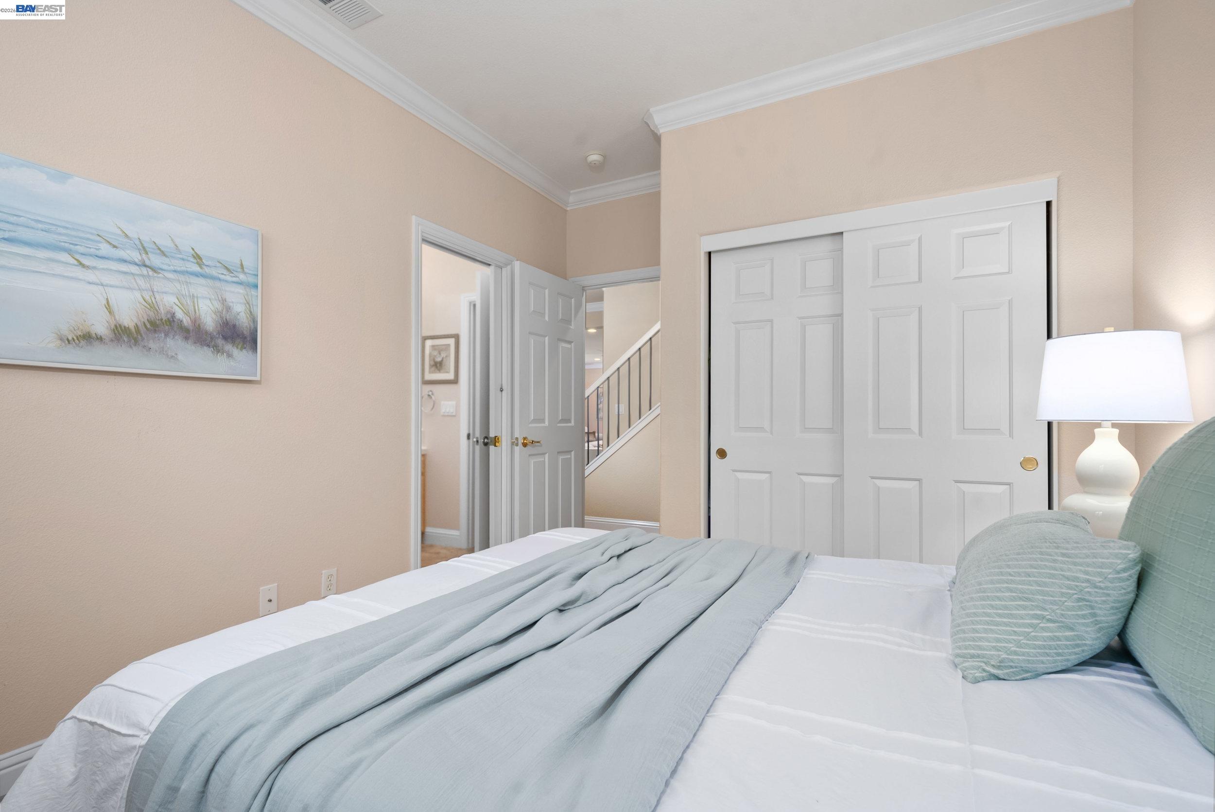 4717 Chestnut Court Dublin, CA 94568 - Photo 22 of 60 a bedroom with a bed and a lamp