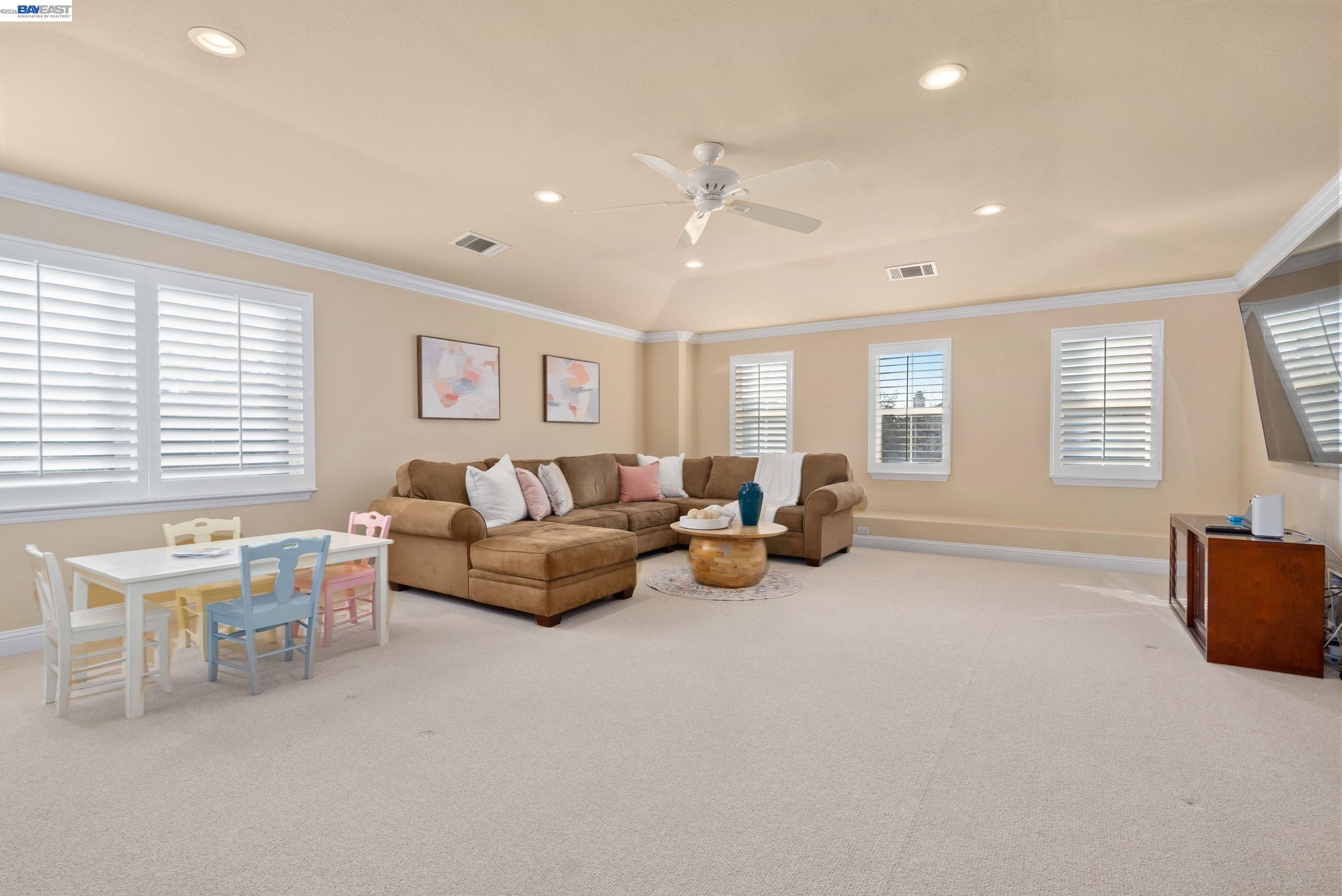 4717 Chestnut Court Dublin, CA 94568 - Photo 27 of 60 a living room with furniture and a window