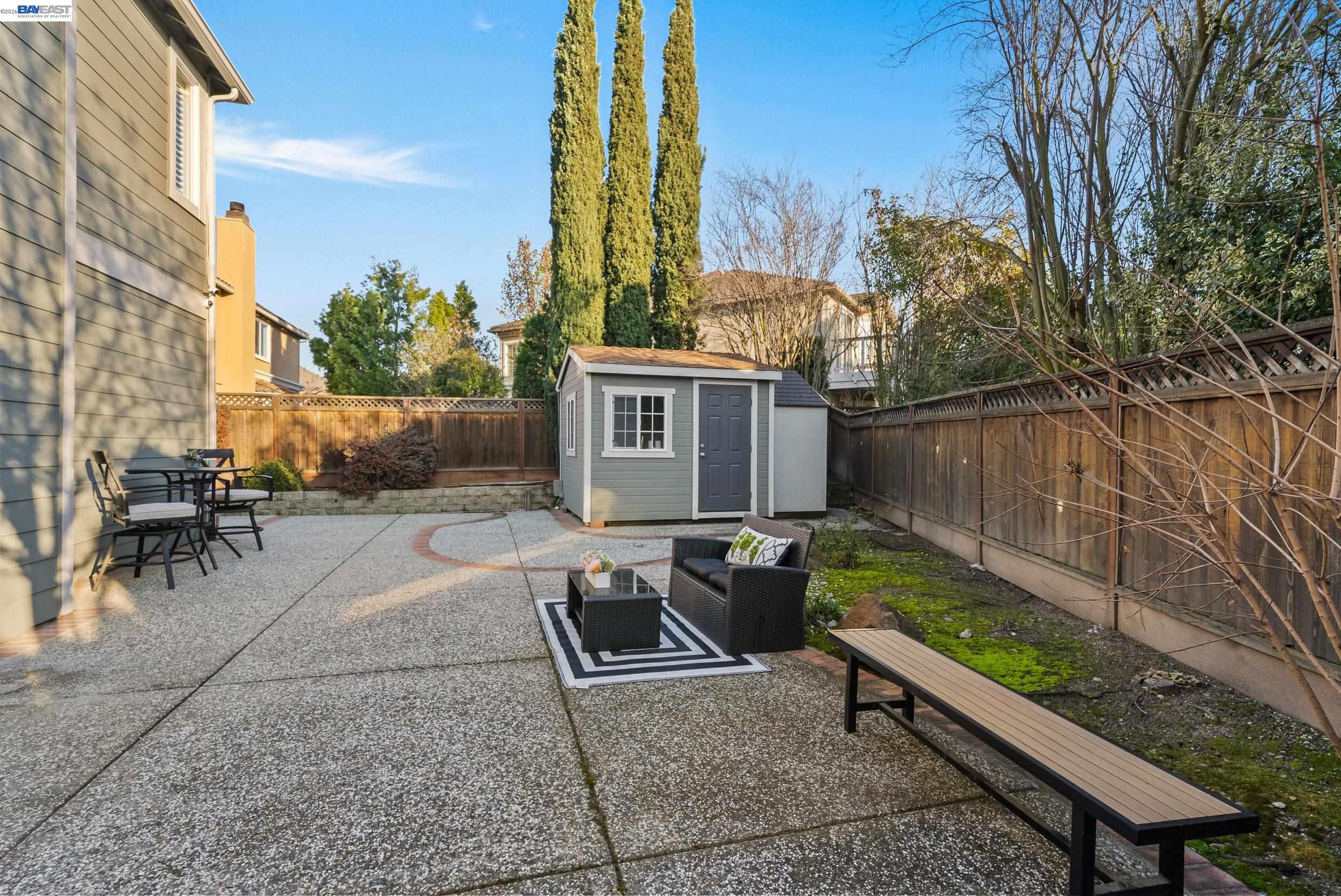 4717 Chestnut Court Dublin, CA 94568 - Photo 35 of 60 a view of a patio with a table and chairs
