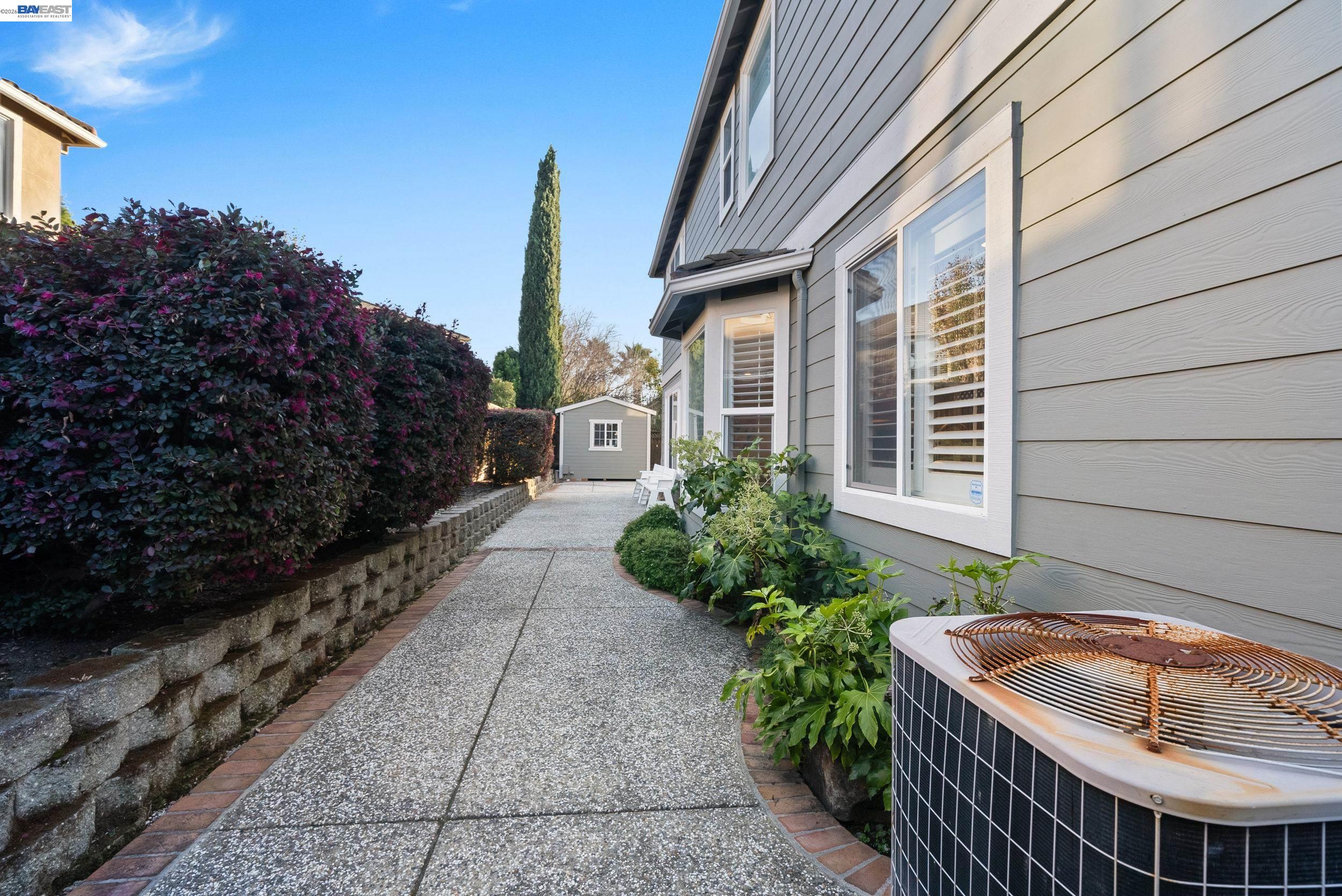 4717 Chestnut Court Dublin, CA 94568 - Photo 36 of 60 a view of house with a tub and trees in the background