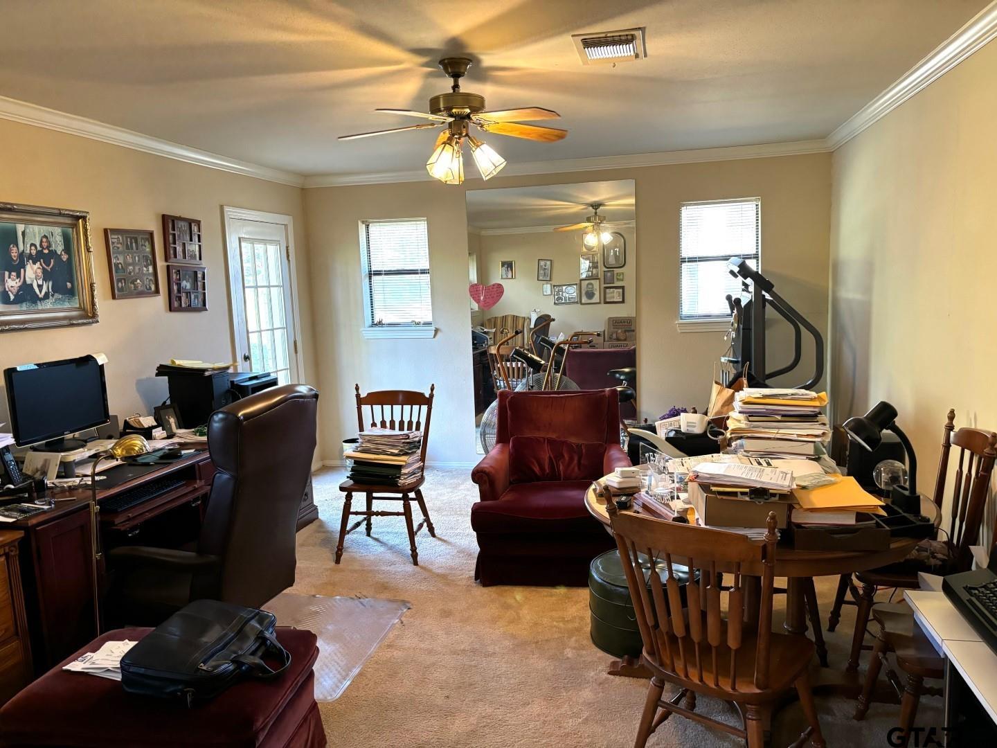 17656 Old River Road Flint, TX 75762 - Photo 12 of 20 a living room with furniture a chandelier and a flat screen tv