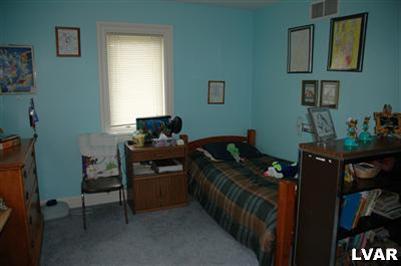 20 Frys Run Road Easton, PA 18042 - Photo 17 of 24 a room that has a bed and a chair in it