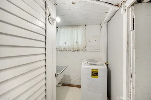 a white toilet sitting next to a bathroom sink