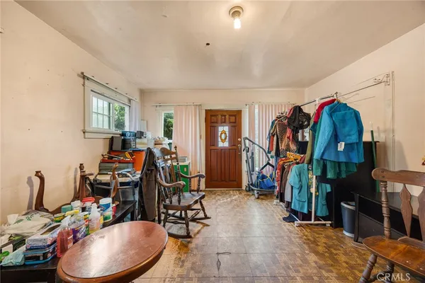 a view of a room with chairs and windows
