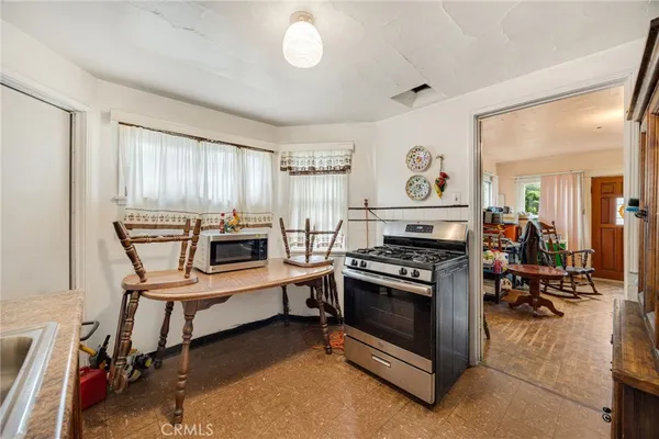 a kitchen with a sink appliances and cabinets
