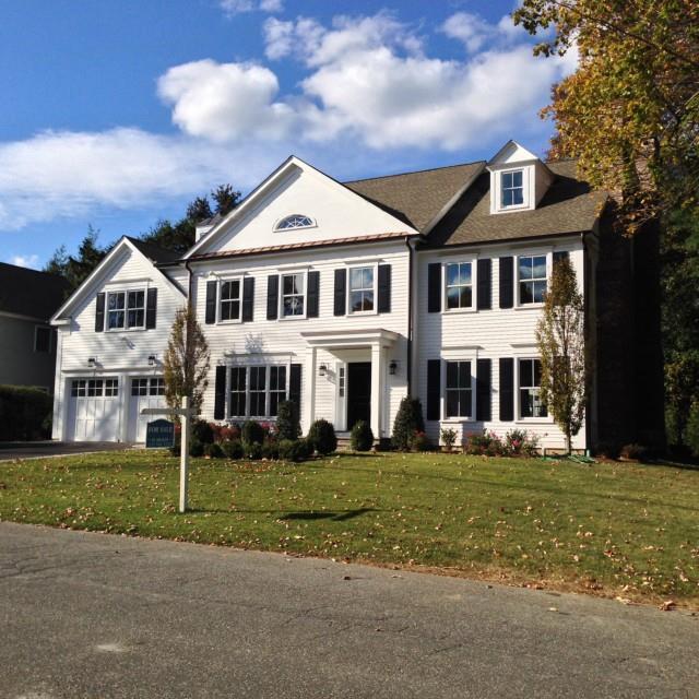 23 Douglas Road New Canaan, CT 06840 - Photo 1 of 1 a front view of a house with a yard