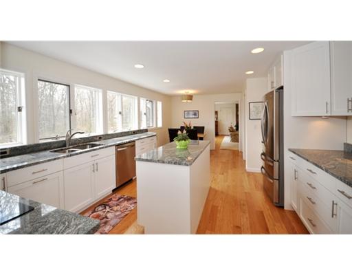 4 Ranger Court Jamestown, RI 02835 - Photo 5 of 12 Kitchen. KITCHEN LEADING INTO THE FAMILY ROOM WITH FIREPLACE AND SLIDERS TO LARGE DECK