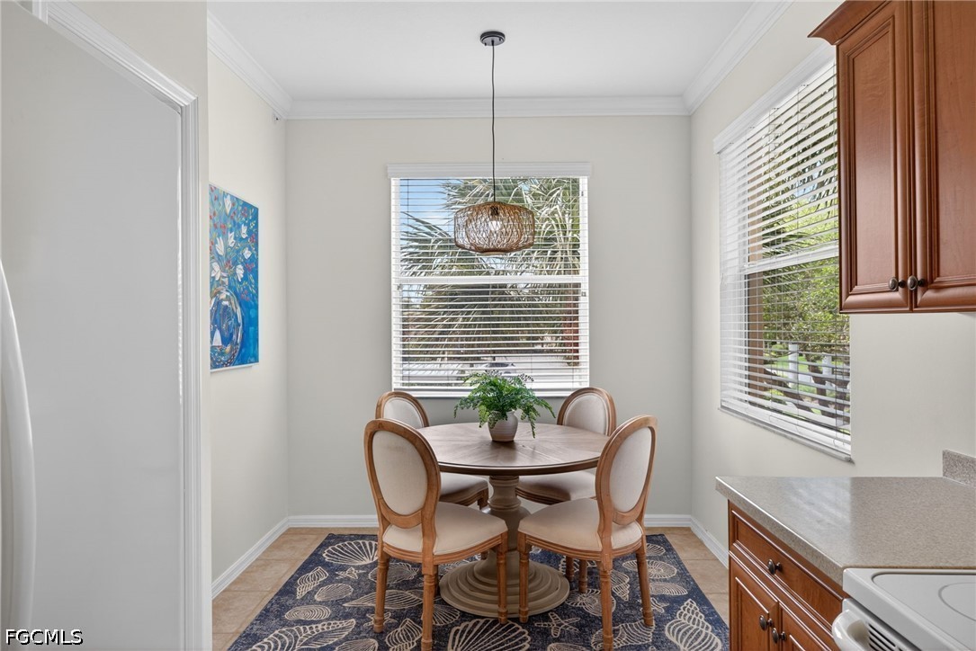 8251 Pathfinder Loop, Unit 621 Fort Myers, FL 33919 - Photo 9 of 30 a dining room with furniture window and outside view