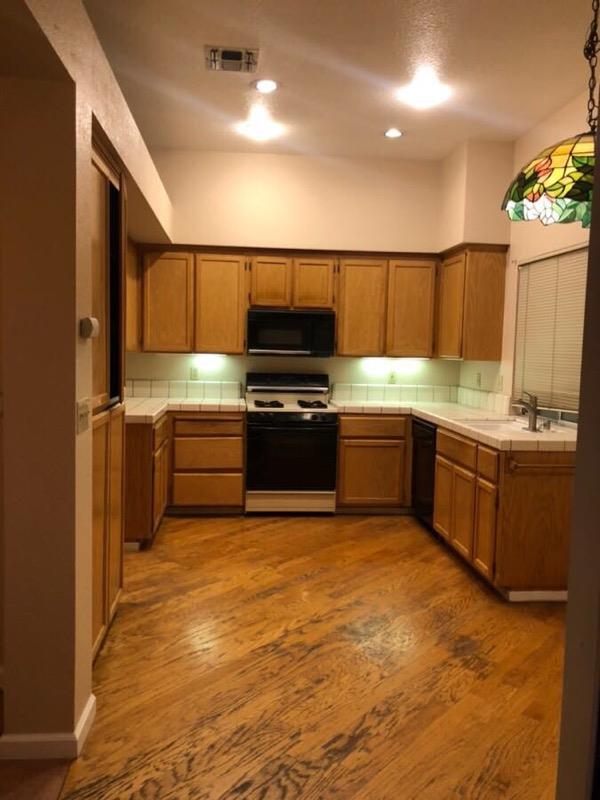 8584 Canyon Brook Way Elk Grove, CA 95624 - Photo 4 of 7 a kitchen with a sink cabinets and appliances