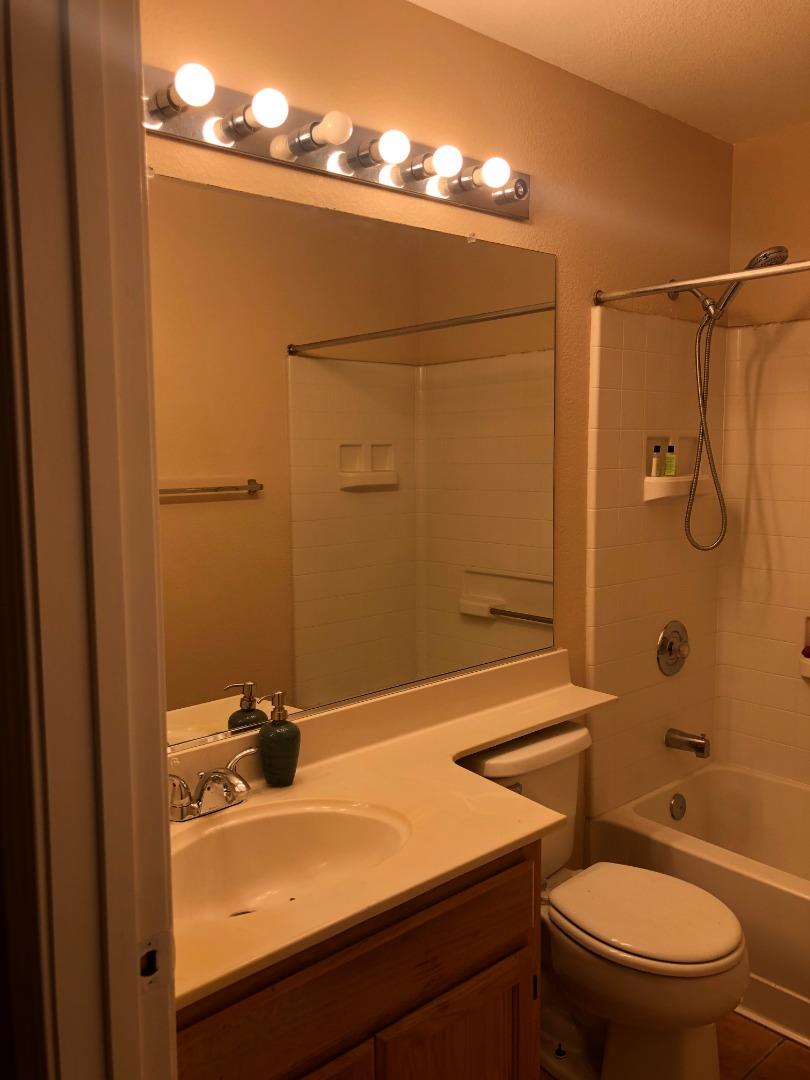 8584 Canyon Brook Way Elk Grove, CA 95624 - Photo 6 of 7 a bathroom with a sink a toilet and shower