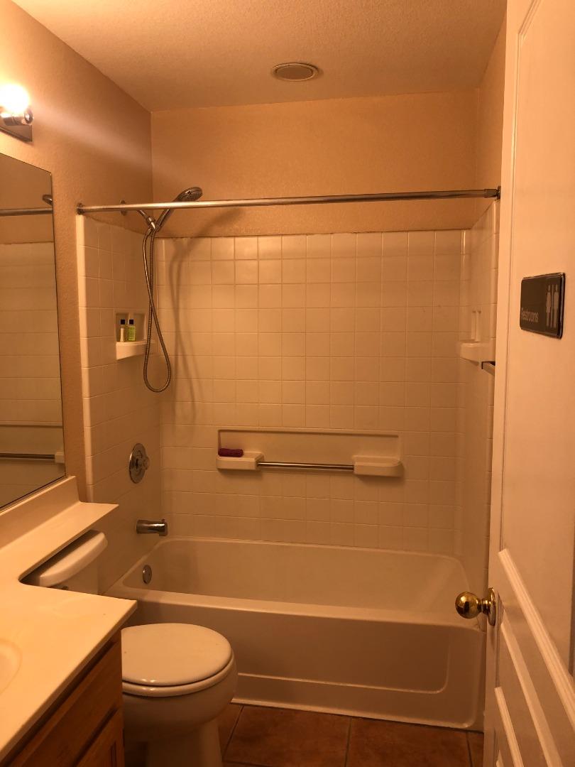 8584 Canyon Brook Way Elk Grove, CA 95624 - Photo 7 of 7 a bathroom with a shower a toilet and sink