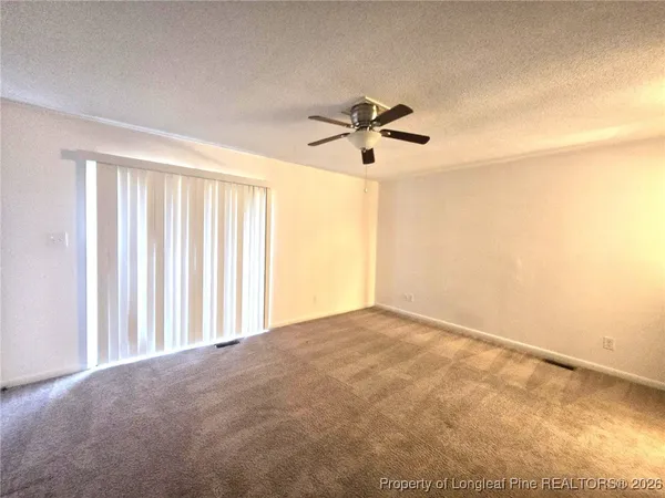 a view of a big room with carpet