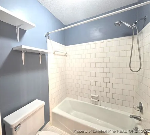 a bathroom with a shower and bathtub