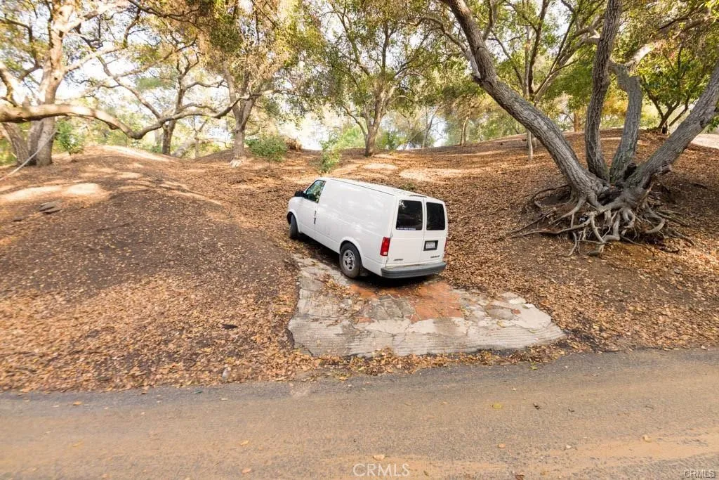 0 Elzevir Road Woodland Hills, CA 91364 - Photo 11 of 28 a white house that has tree in front of it