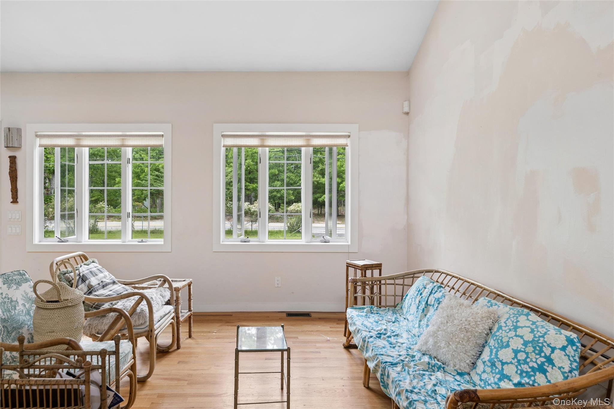 131 Red Creek Road Hampton Bays, NY 11946 - Photo 8 of 35 a living room with furniture and a window