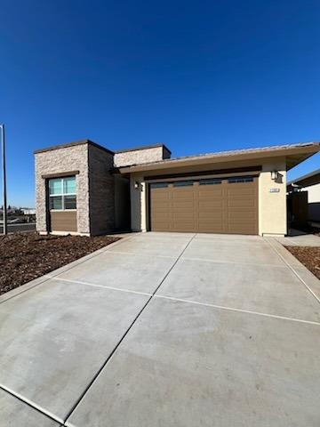 11501 Lagarto Way Rancho Cordova, CA 95742 - Photo 3 of 10 a front view of a house with a garage