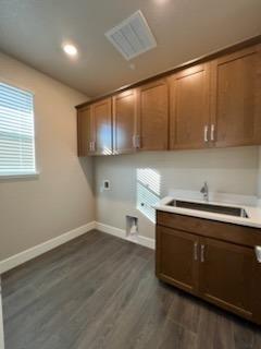 11501 Lagarto Way Rancho Cordova, CA 95742 - Photo 5 of 10 a kitchen with stainless steel appliances a sink stove and cabinets