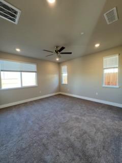 11501 Lagarto Way Rancho Cordova, CA 95742 - Photo 7 of 10 an empty room with a window and a ceiling fan