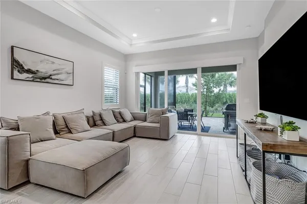 a bedroom with a bed and a flat tv screen