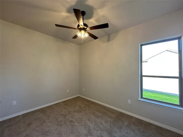 a room with a sink and cabinets