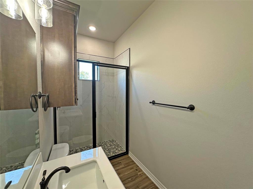 133 Lasso Loop Lorena, TX 76655 - Photo 21 of 22 a bathroom with a sink and shower