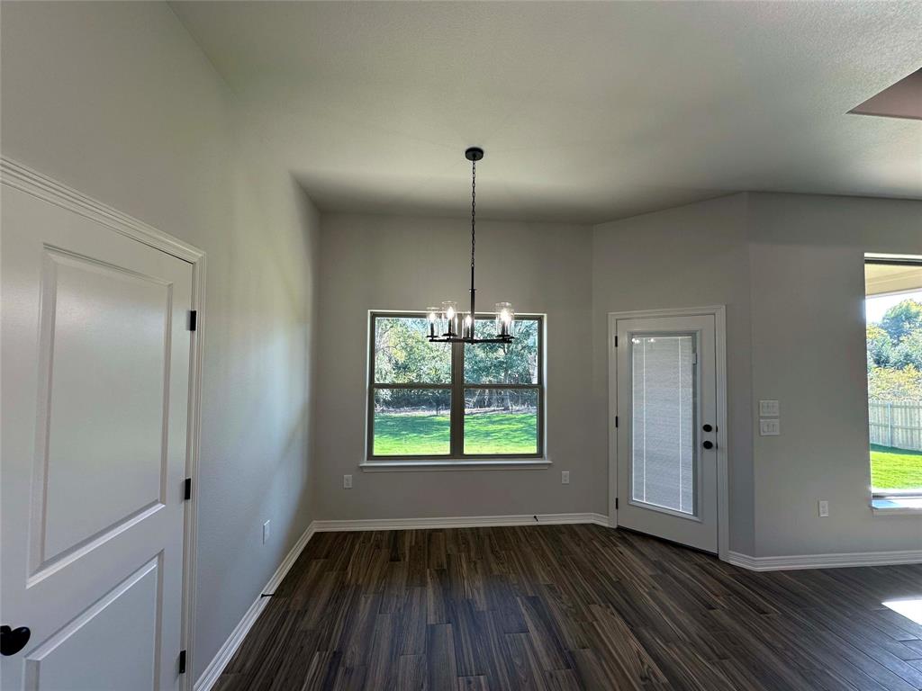 133 Lasso Loop Lorena, TX 76655 - Photo 7 of 22 a view of empty room with window and wooden floor